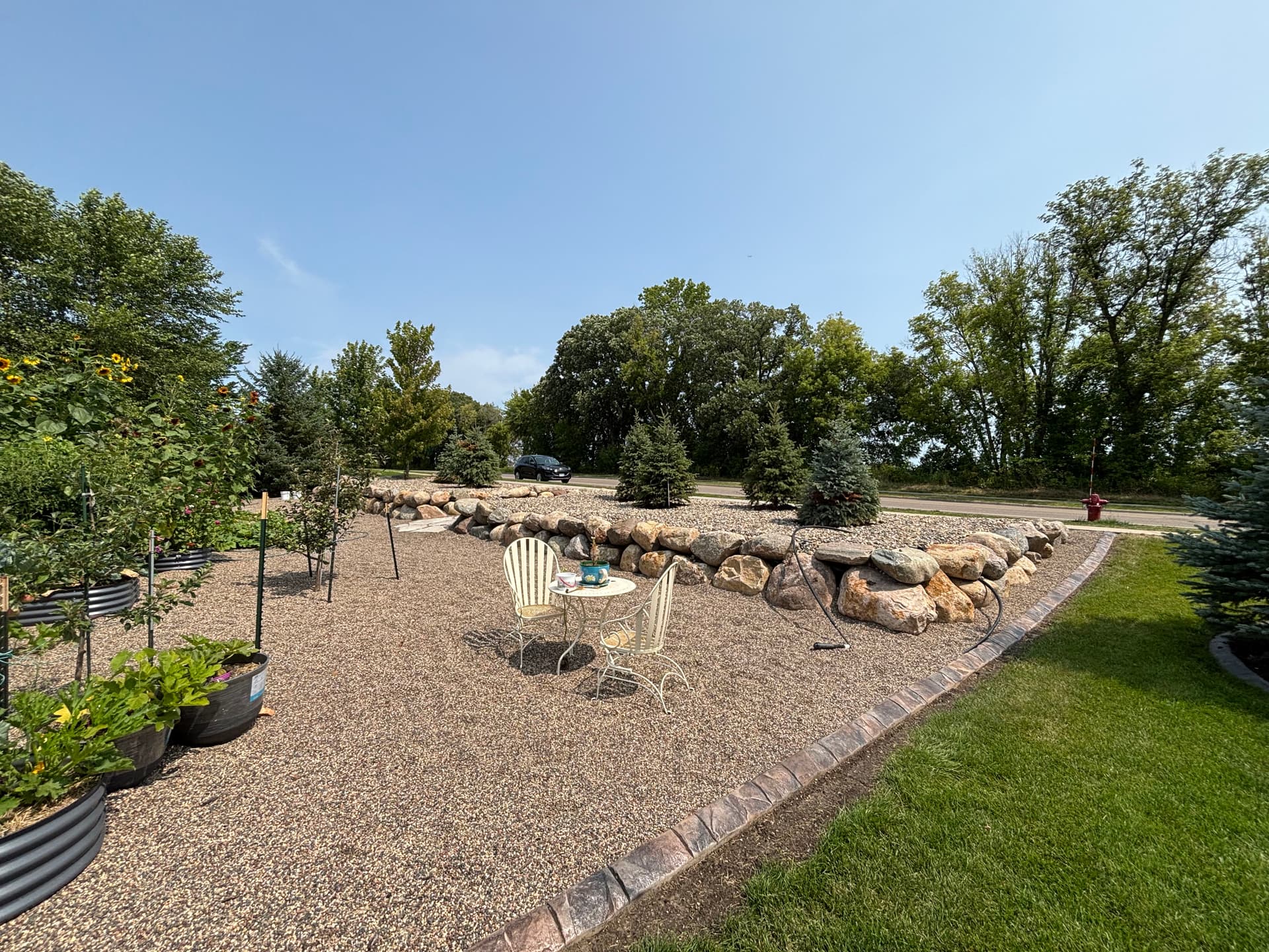 Gallery photos for Boulder Walls and Natural Stone Walkway Turn a Sloped Hillside Into Usable Space: Image #1