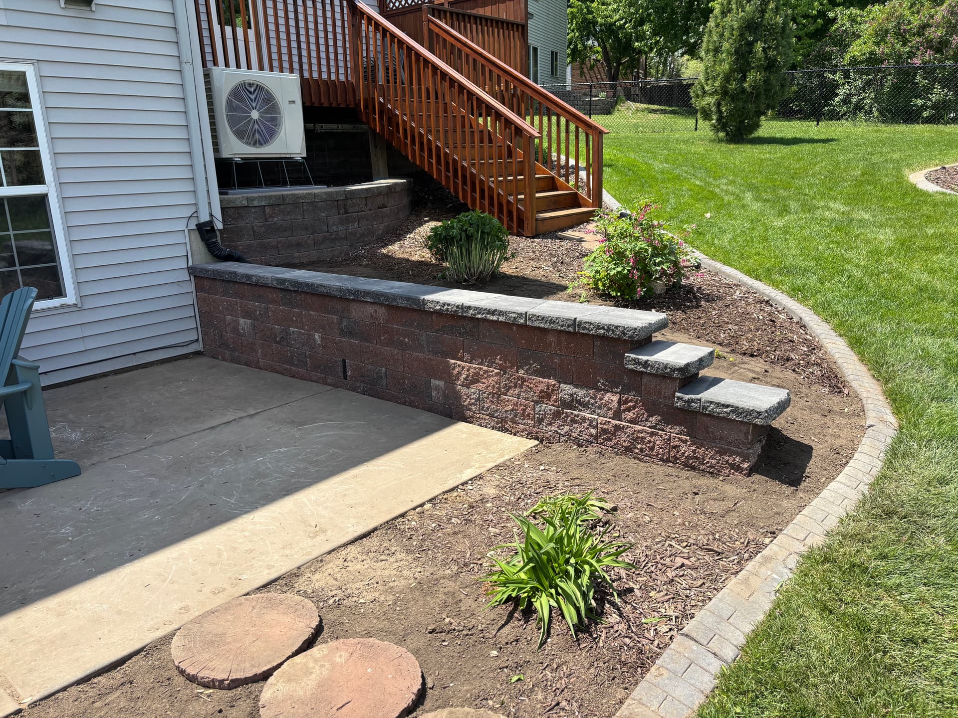 Failing Retaining Walls Rebuilt Right With Versa-Lok and Proper Drainage image