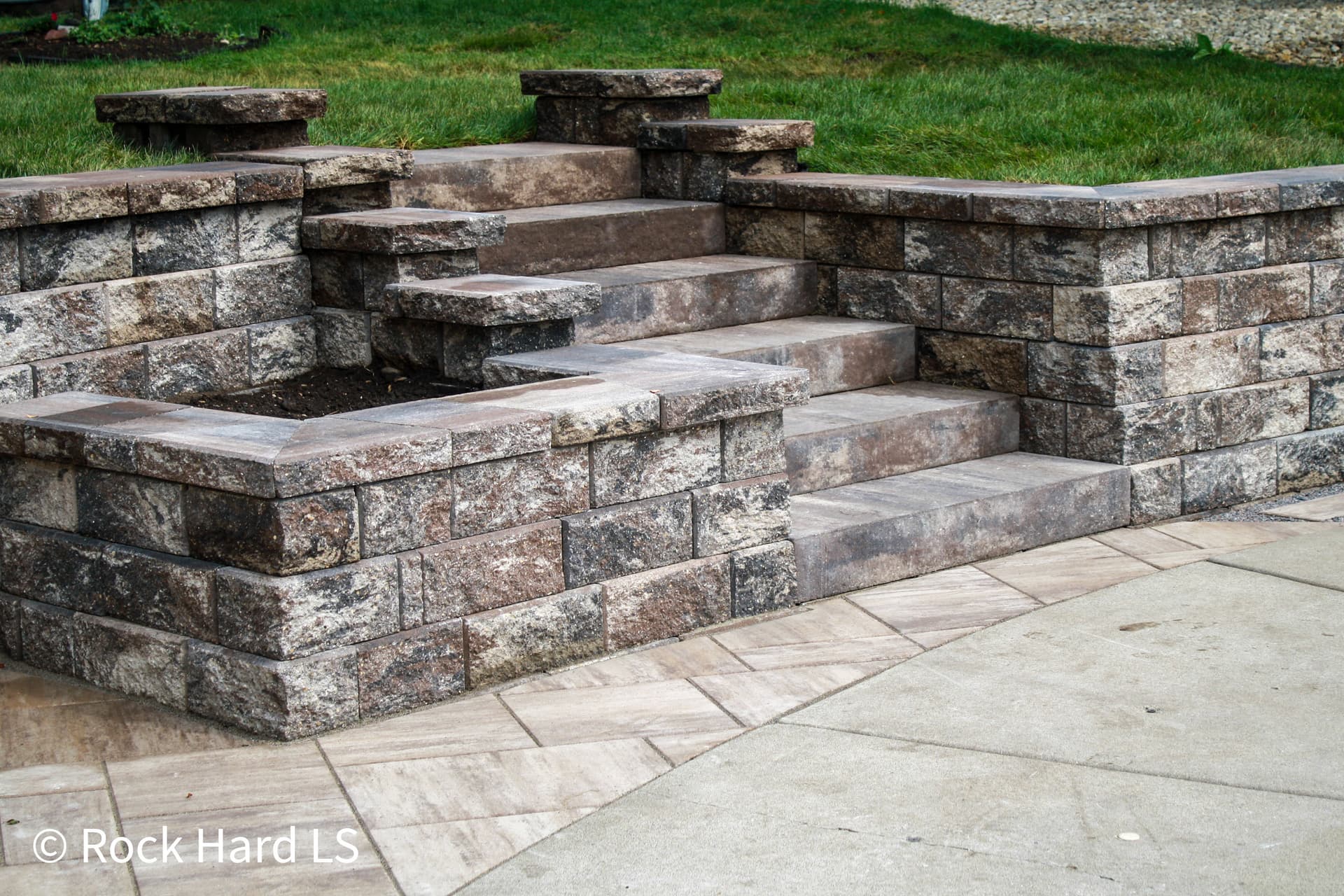 Old Block Wall Replaced With County Splitface Retaining Wall and Paver Patio image
